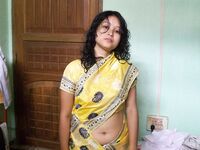 Indian wife changes attire while pleasuring her husband on bed POV style