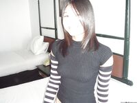 Young asian girl exposing her tiny tits and trimmed juicy cunt