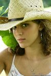 Teen amateur Karen lets denim skirt ride up to expose her underwear in yard