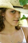 Teen amateur Karen lets denim skirt ride up to expose her underwear in yard