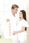 Beautiful French nurse Tiffany Doll gets her beaver toyed by a horny doc
