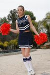 Teen cheerleader Dani Daniels pulls up her skirt to toy her gloryhole