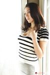 Japanese female Ruri Hayami lifts up her shirt wearing a white bra