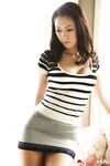 Japanese female Ruri Hayami lifts up her shirt wearing a white bra