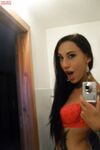 Teen with an inked body Ella Storm takes selfies while stripping in the mirror