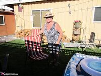 Fatty mature granny Girdle Goddess peels to enjoy wading pool skinny dip