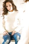 Playful babe in blue jeans Hillary Fisher uncovering her amazingly sexy curves