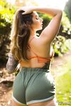 Thick female Paige Turnah exposes her tits in the backyard wearing shorts