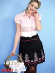Beautiful woman in short skirt & silk lingerie strips in vintage pinup porn