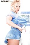 Blonde MILF Lisa Lipps uncorks her huge tits in jean shorts and heels