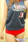 Young cheerleader Amy lifts her uniform to tease with sexy panties & underboob