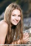Teen babe Izabel A sporting nice camel toe outdoors on beach in bikini