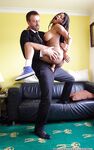 Busty black amateur Kiki Minaj rides a cock wearing her sneakers
