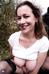 Horny granny Eva Jayne gets cum on her face after a gangbang in a field