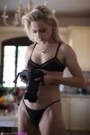 Blonde girl Chloe Toy drinks and smokes while modeling lingerie
