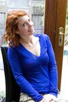 Cute redhead Kara Dashka shows her pale natural tits & spreads in the window