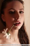 Sultry teen Valery Leche gets into a petal filled tub after removing lingerie