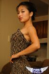 Hot Asian beauty Aria Lee bares her breasts and hikes her sexy dress