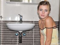 Young cutie Zoey Ryder bares her tiny tits and blows bubbles on the toilet