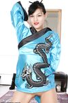 Amateur Asian babe in kimono spreading her freshly shaved pussy