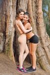Amateur hons Kristen and Nina pose and toy cunts in the middle of the woods
