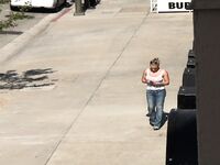 Oblivious busty Karmen Jay's big tits captured in downblouse voyeur photos