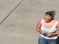 Oblivious busty Karmen Jay's big tits captured in downblouse voyeur photos
