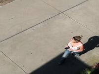 Oblivious busty Karmen Jay's big tits captured in downblouse voyeur photos