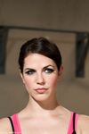 Hot slim Bobbi Starr poses in a black outfit as Bella Wilde stretches topless