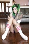 Green haired glasses wearing hottie exposes huge melons & spreads pussy lips