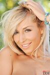 Blonde seductress Sexy Venera flaunting her saggy natural tits outdoors