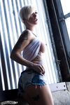 Alluring blonde babe with short hair and slender body showing off in solo act