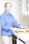 Mature housewife Annabelle Brady washing her hungry pussy in the kitchen sink