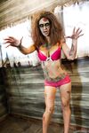 Saucy brunette cosplayer Kleio unveils her zombie tits and pussy