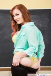 Redhead American schoolteacher Dani Jensen strips to her nylons atop her desk