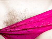 Amateur glasses laden chick Nora spreads her hairy vagina outdoors