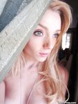 Ally Winters is spreading her slim legs wide open while masturbating