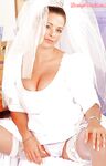 Busty bride Linsey Dawn McKenzie does some rubbing before the wedding.