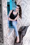 Slender brunette Elly peels her jeans and flexes her sexy toes while naked