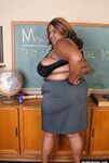 Mature ebony teacher SSBBW Winxx is undressing in the classroom