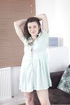 Brunette amateur Misungui reveals her hairy crotch and poses on a couch