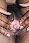 Black girl Janelle Taylor grabs her ass before revealing the pink of her pussy