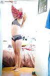 Bushy amateur Lynn caught on hidden camera getting dressed after nude poses
