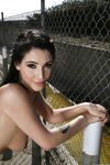 Hot babe Noelle Easton posing outdoors in sports bra and short shorts