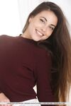 Nice young girlLorena B sports a nice smile while showing her legs