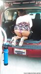 Busty black girl Porsha Carrera bends over in high heels for upskirt