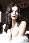 Beautiful centerfold babe Alexandra Tyler posing in hat and furs