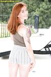Natural redhead Jayme Rae strips and plays with her pussy on the patio