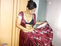 Clothed Indian woman strips to her black bra and underskirt