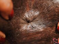 Cute ebony babe Jasmine pours a lot of oil into her anal hole